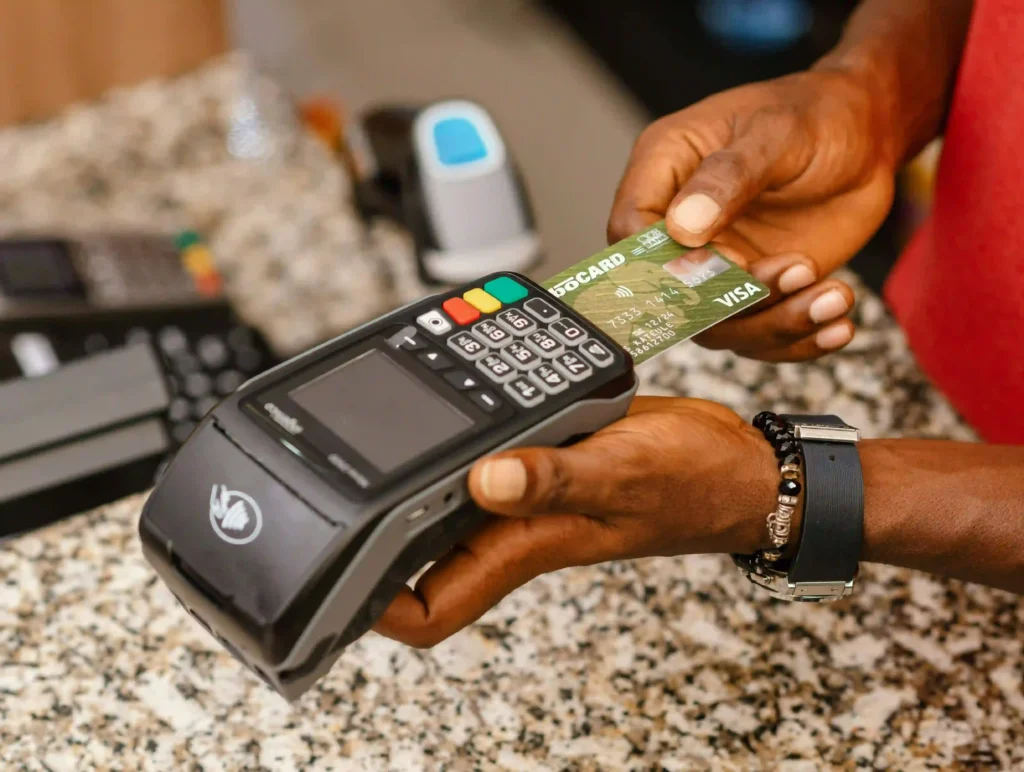 a man using pos terminal, How to start pos business in nigeria