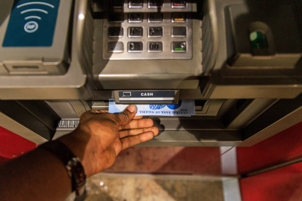 Image of a man withrawing from ATM, Best loan apps in Nigeria